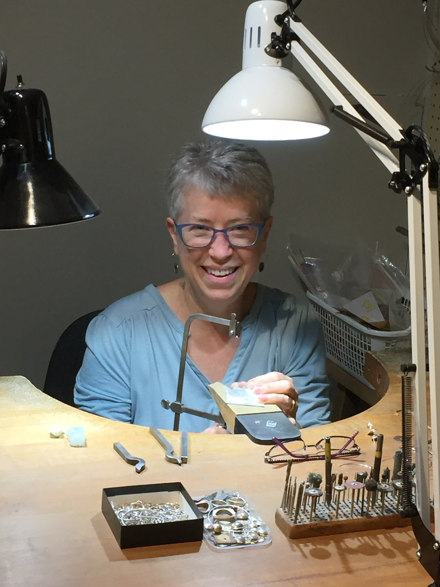 Valerie Davidson working at her jewellery bench.